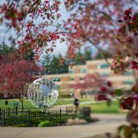 The globe sits on the campus green.