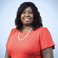 Dr. Sonia Dinnall ’88, alumna of the University, is now the first woman in Springfield Public Education history to be appointed to superintendent. She is wearing a peach colored shirt and posing in front of a light blue background.